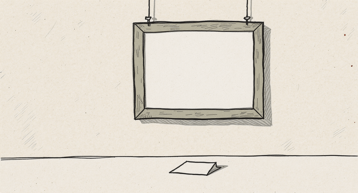 A picture frame hangs straight and level on a clean white wall, but the frame is empty -- it holds only a blank white mat. A small folded card rests face-down on the floor beneath it. Everything looks correct from a distance.